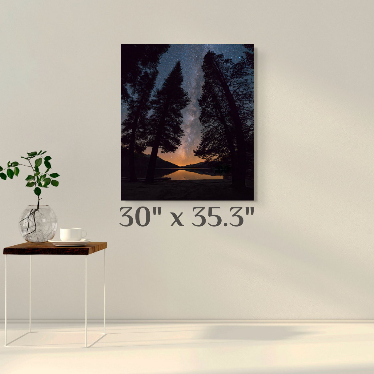 A wall art mockup featuring the night photograph titled, "All is Calm" shot by landscape photographer J K Lovelace, on display as a 30 inch wide metal print with inset frame.