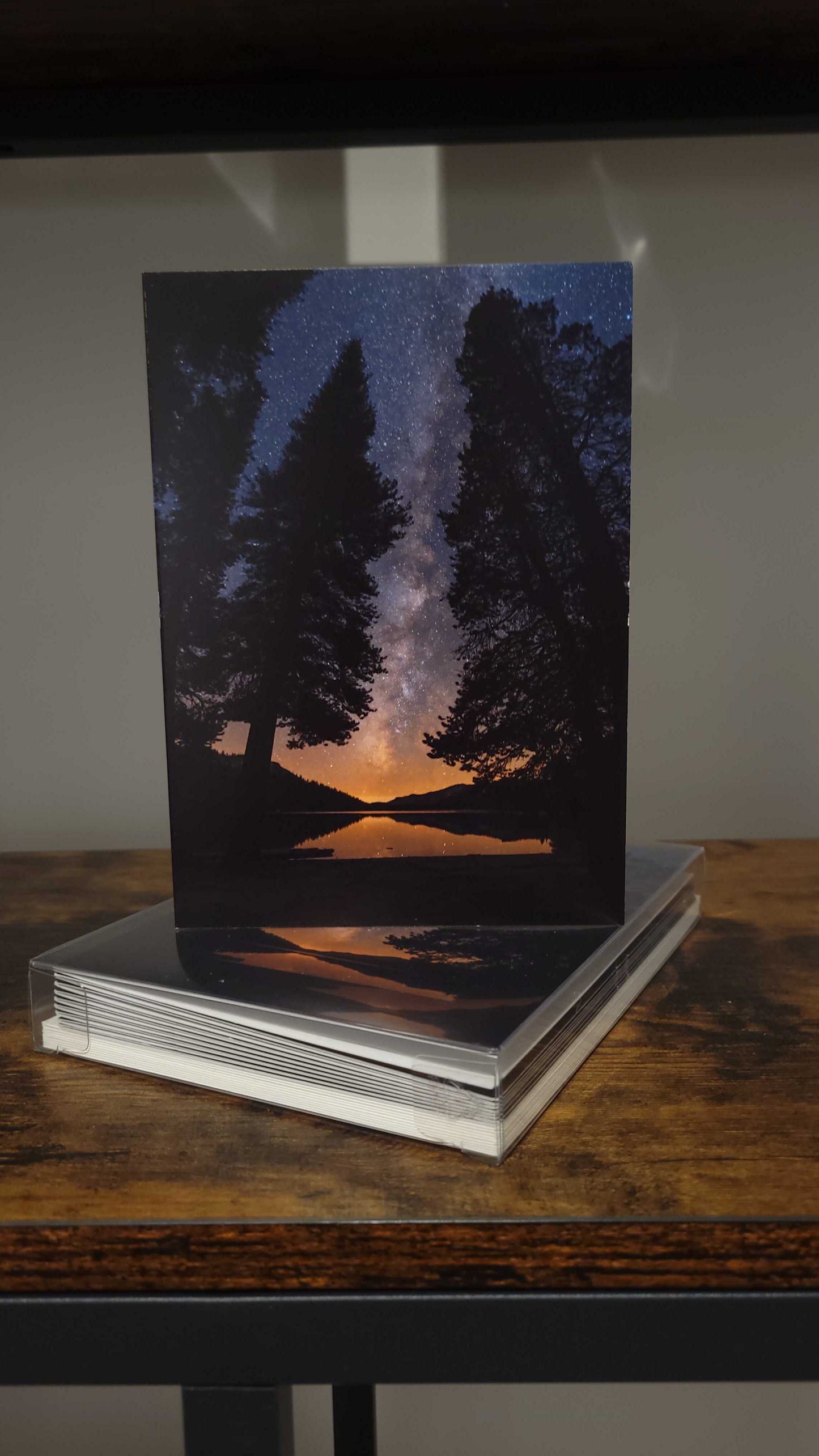 A photograph of a holiday greeting card set featuring the photograph "All is Calm" on the front cover