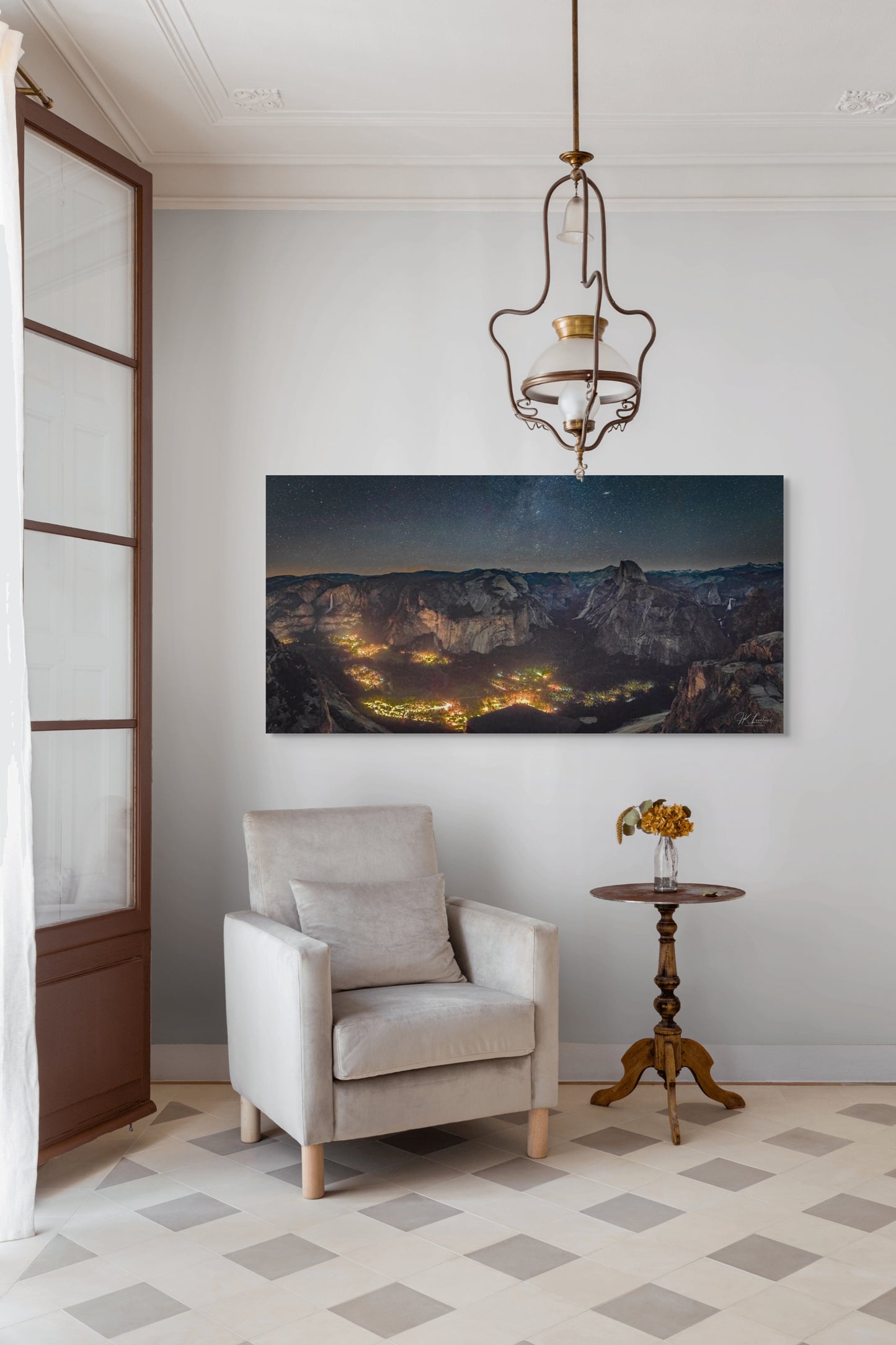 A wall art mockup featuring the photograph titled "Artificial Darkness" by landscape photographer J K Lovelace as a 60 inch wide metal print with inset frame on display in a traditional home.