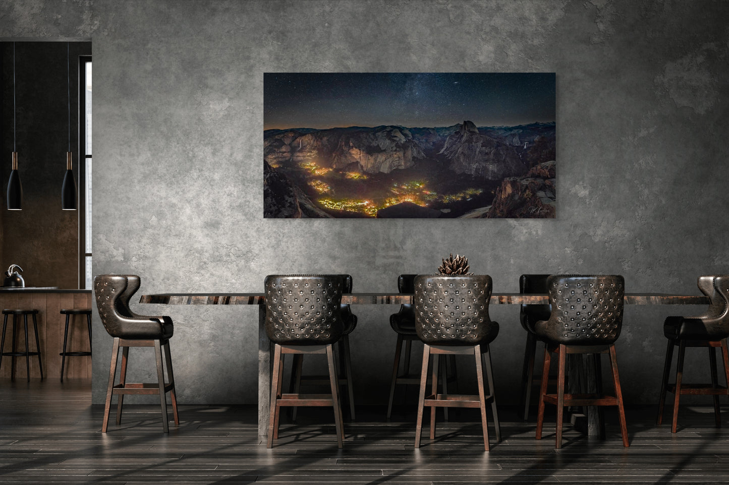 A wall art mockup featuring the photograph titled "Artificial Darkness" by landscape photographer J K Lovelace as a 60 inch wide metal print with inset frame on display in an industrial dining room.