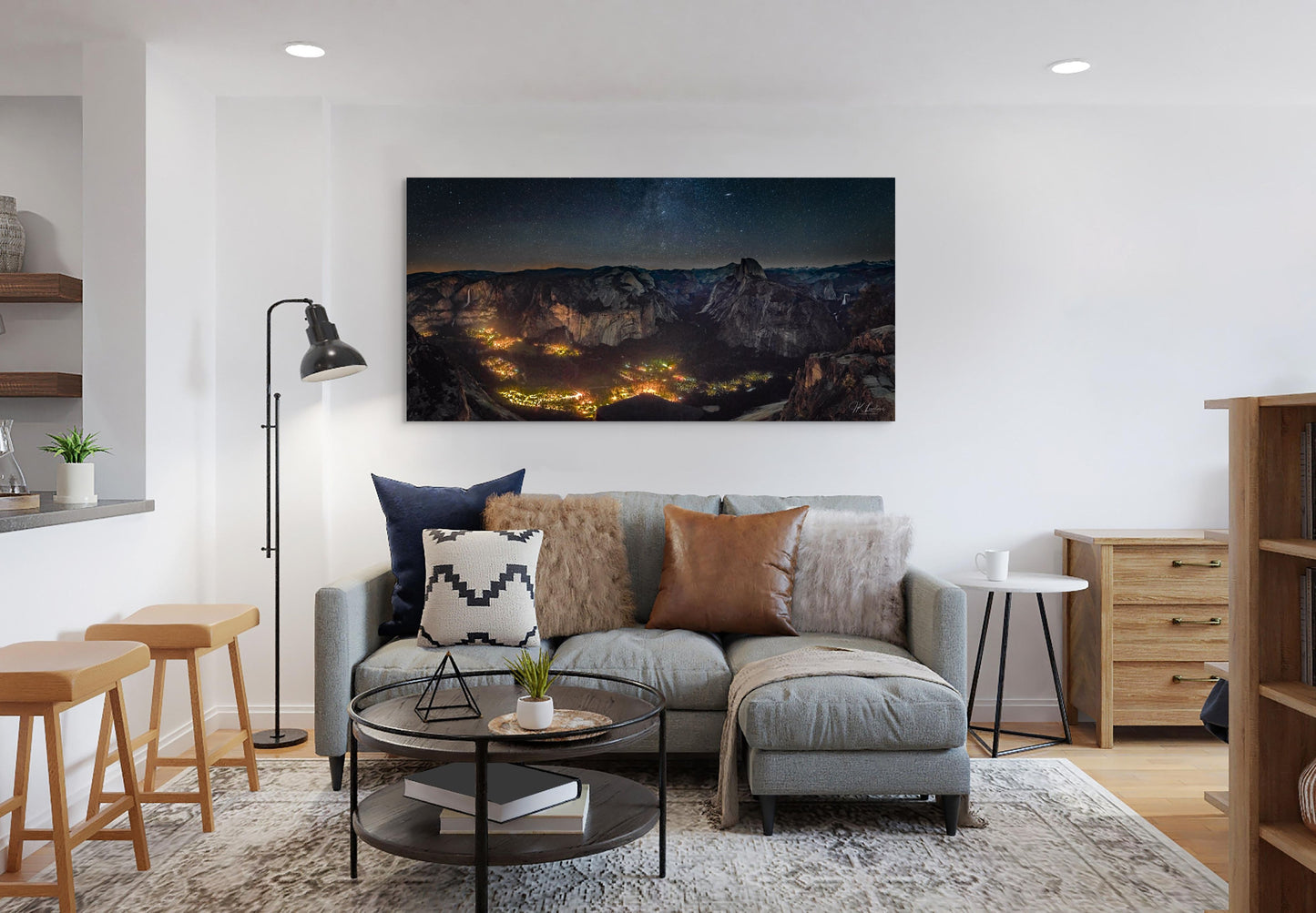 A wall art mockup featuring the photograph titled "Artificial Darkness" by landscape photographer J K Lovelace as a 60 inch wide metal print with inset frame on display in a contemporary apartment.
