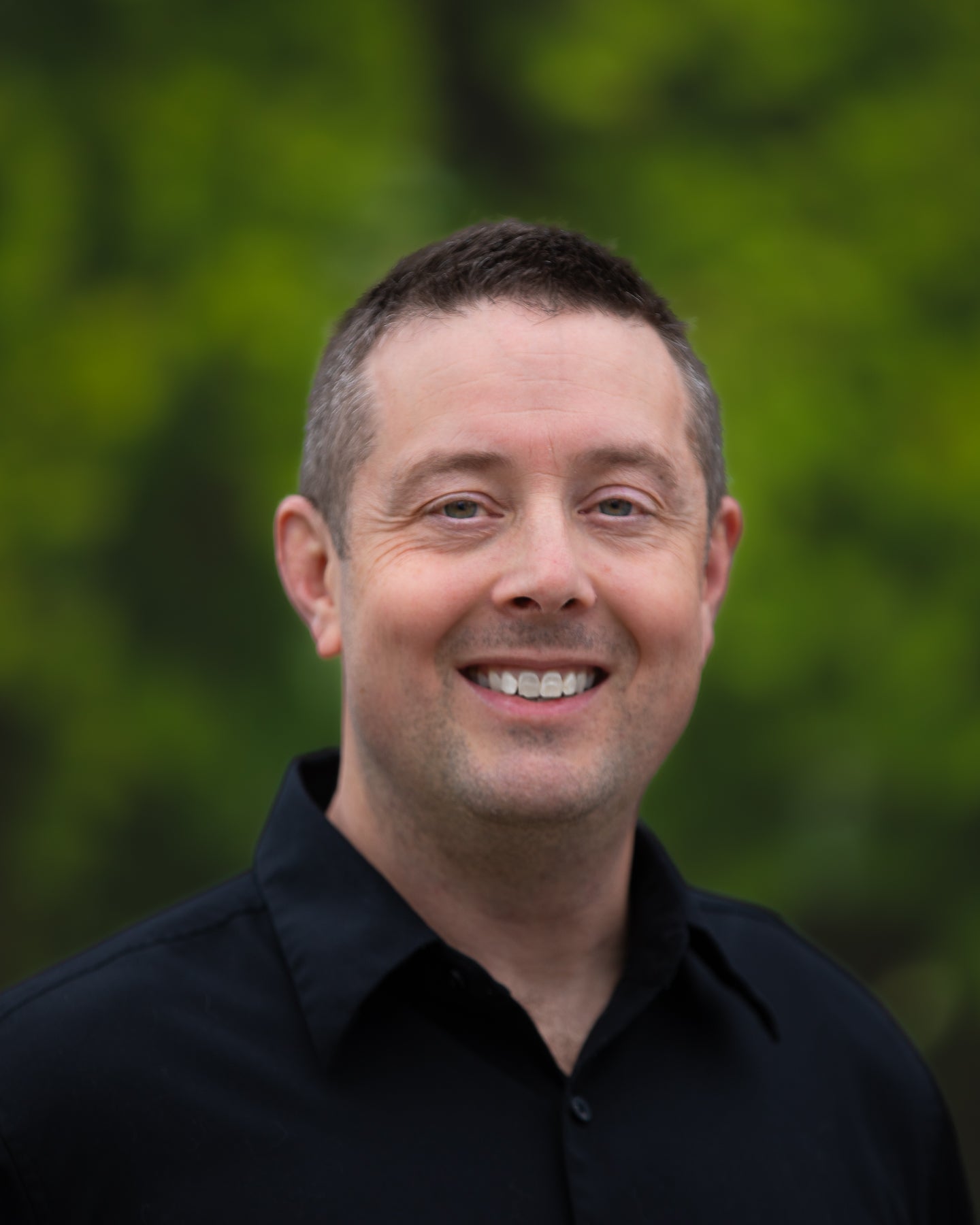 A headshot of award winning landscape photographer Ben Coffman