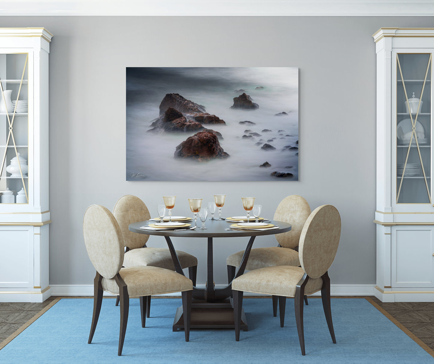 A wall art mockup featuring the photograph titled "Beyond Here Be Dragons" by landscape photographer J K Lovelace as a 60 inch wide metal print with inset frame on display in a traditional dining room.
