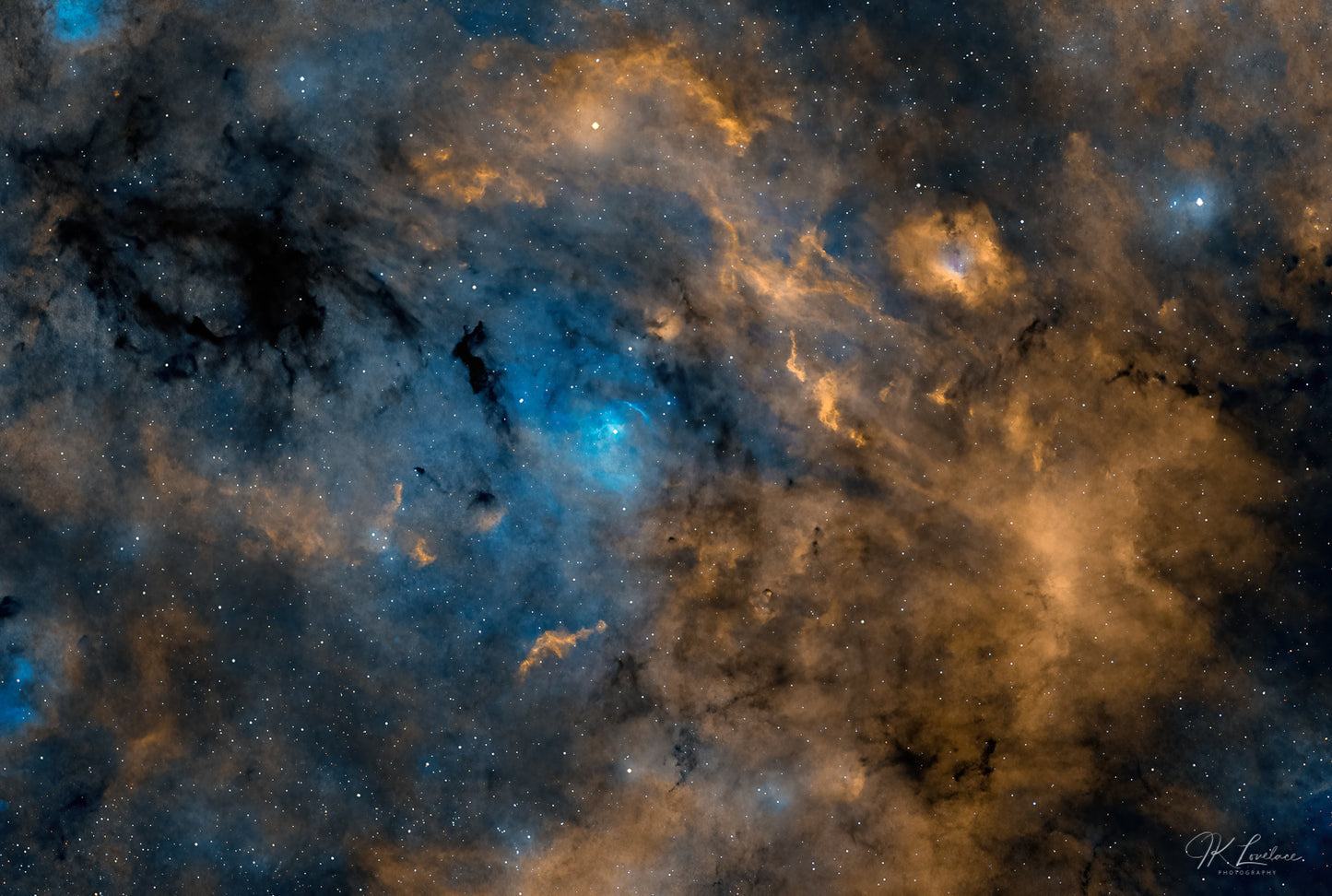 A jpg of the deep sky photograph titled Clouds of Light and Darkness by astrophotographer J K Lovelace featuring the abstract dark nebulae Barnard169 and Sh2-134