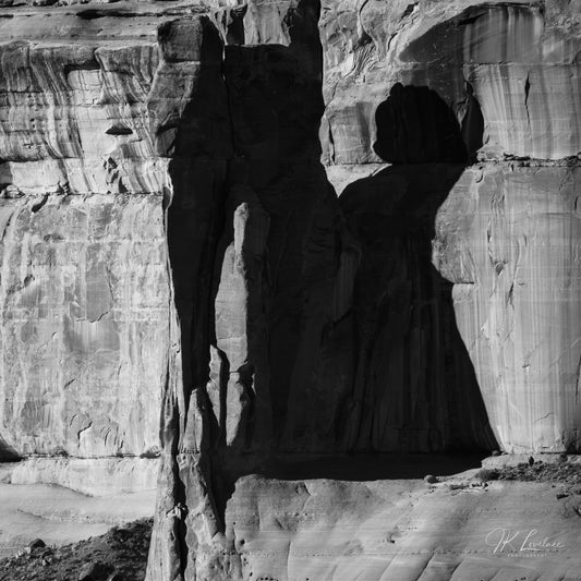A jpg of the abstract black and white photograph titled "Disney Meets Escher" shot by landscape photographer J K Lovelace, featuring  abstract rock formations and shadow play