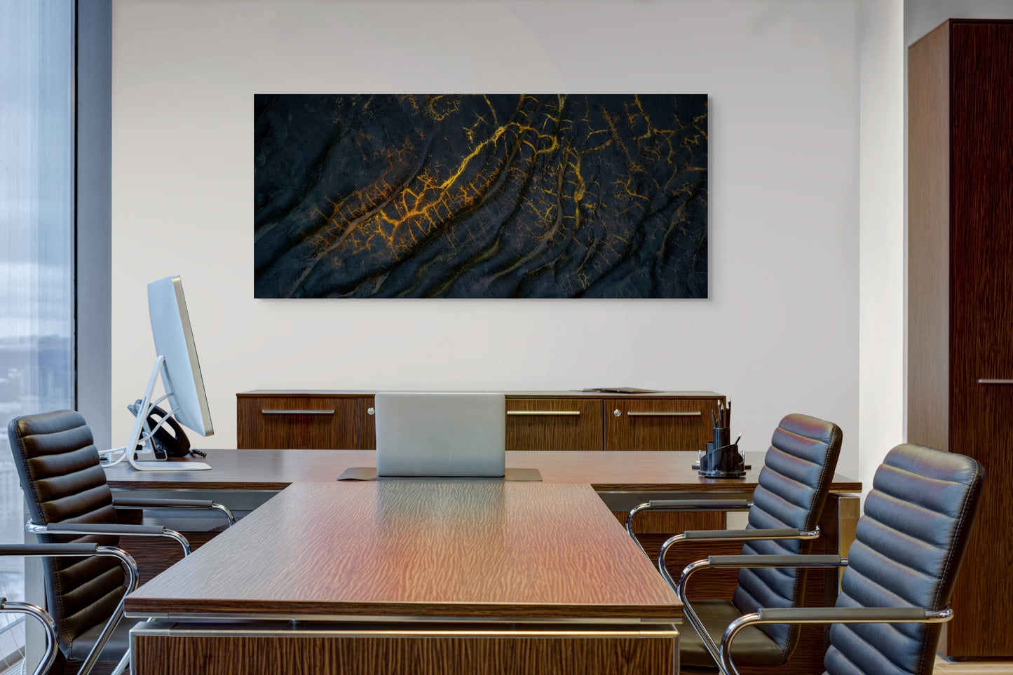 A wall art mockup featuring the photograph titled "Golden Veins" by landscape photographer Ben Coffman as a 60 inch wide metal print with inset frame on display in a corporate boardroom.
