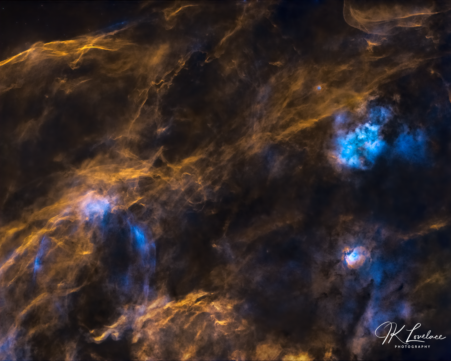 A png of the deep sky (starless) photograph titled, "Huge and Mighty Forms" shot by astrophotographer J K Lovelace, featuring nebulosity within northern Cygnus.