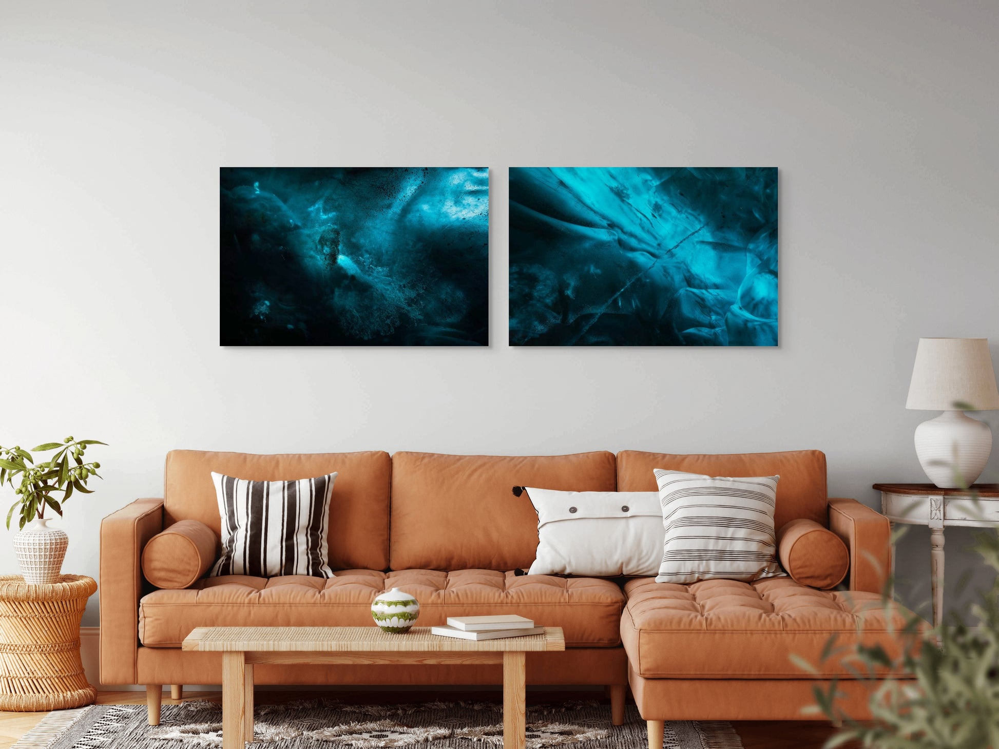 A wall art mockup featuring the photographs titled "Ice Nebulae I" and "Ice Nebulae II" by landscape photographer Ben Coffman as 44 inch wide metal prints with inset frames on display in a boho chic living room.