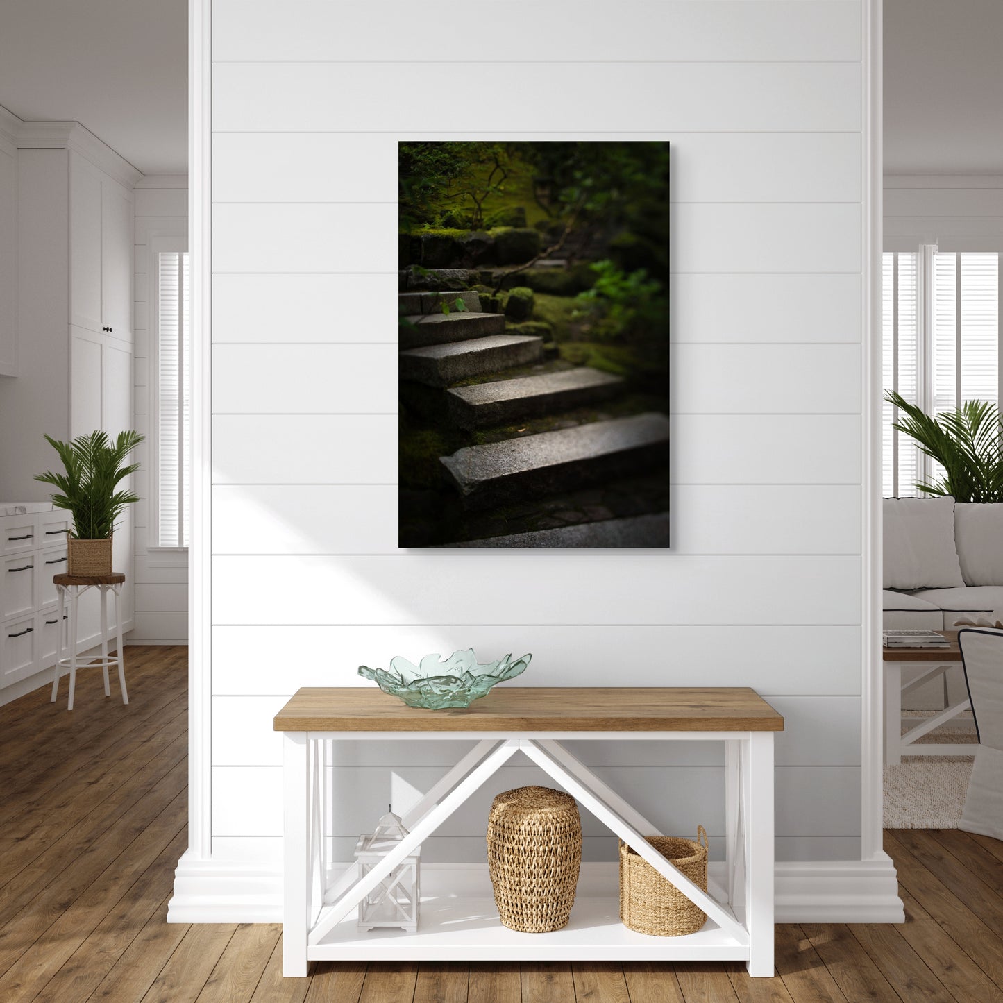 A wall art mockup featuring the photograph titled "Liminal Spaces in the Portland Japanese Garden 10" by landscape photographer Ben Coffman as a 24 inch wide metal print with inset frame on display on a hallway in an upscale beach house.