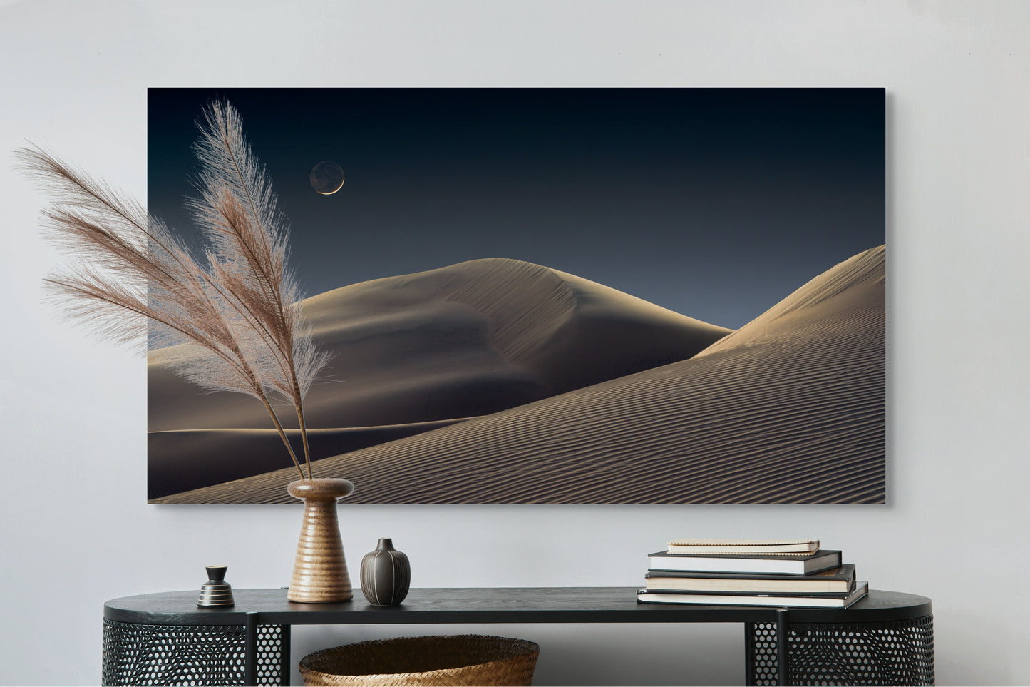 A wall art mockup featuring the photograph titled "Luna Dunes" by landscape photographer J K Lovelace as a 60 inch wide metal print with inset frame on display above black console table.