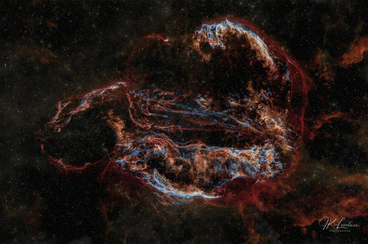 A jpg of the deep sky photograph titled, "Ouroboros" shot by astrophotographer J K Lovelace, featuring deep sky object the Cygnus Loop.