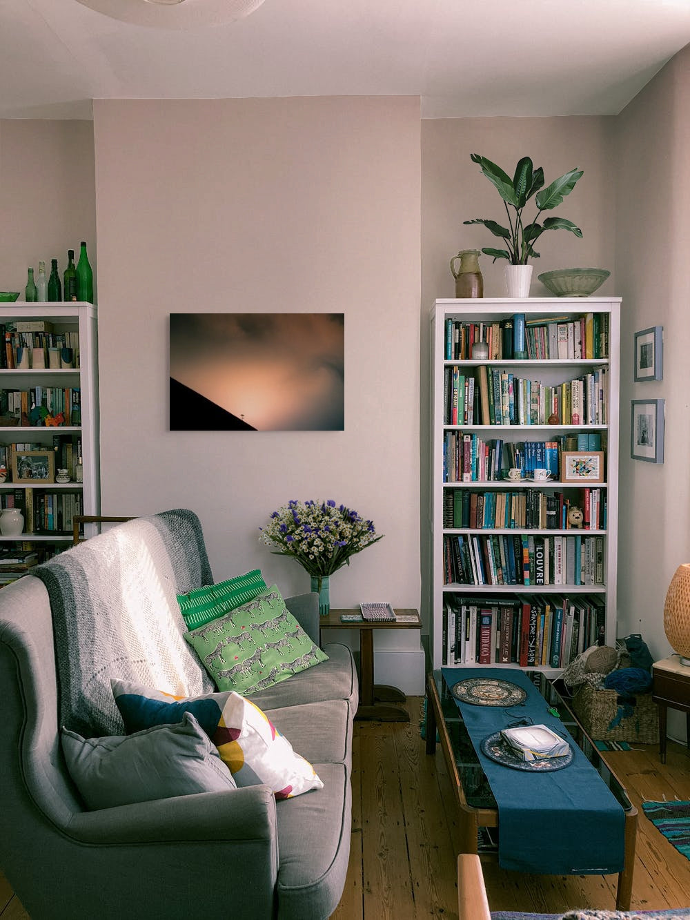 A wall art mockup featuring the photograph titled "Shadow Archetype" by landscape photographer Ben Coffman as a 30 inch wide metal print with inset frame on display in a modern apartment.