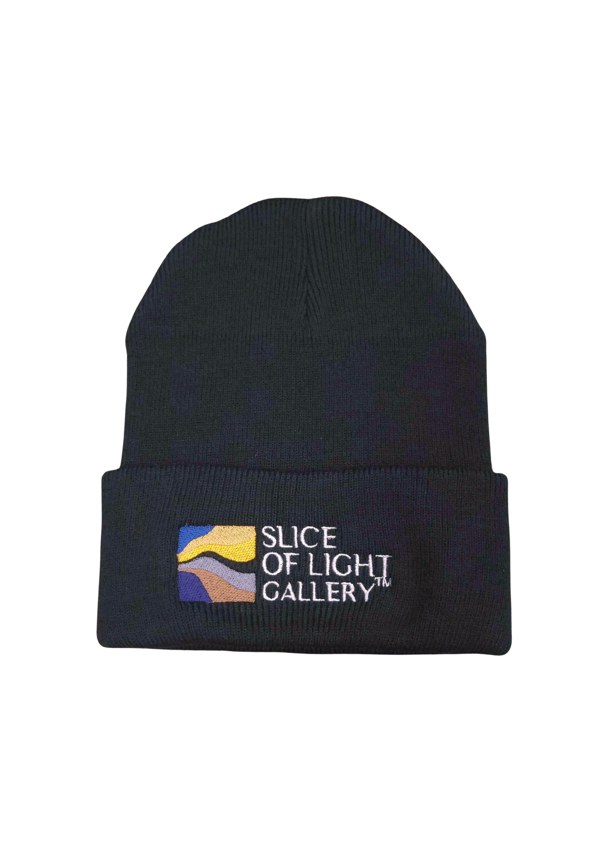 A photograph of a black beanie with colorized Slice of Light logo embroidery with background removed.