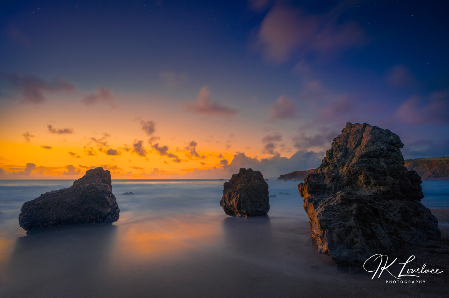 A png of the seascape photograph titled, "Three Pebbles" shot by landscape photographer J K Lovelace, featuring the ocean, sand, and sea, and Sonoma Coast boulders featuring the ocean, sand, and boulders.