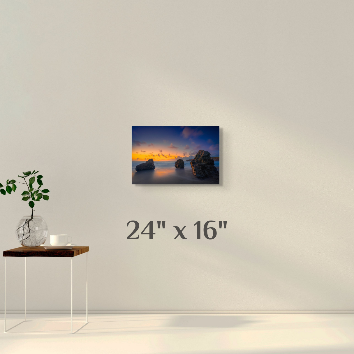 A simple wall art mockup featuring the 24 inch wide metal print titled "Three Pebbles" on display on a wall.