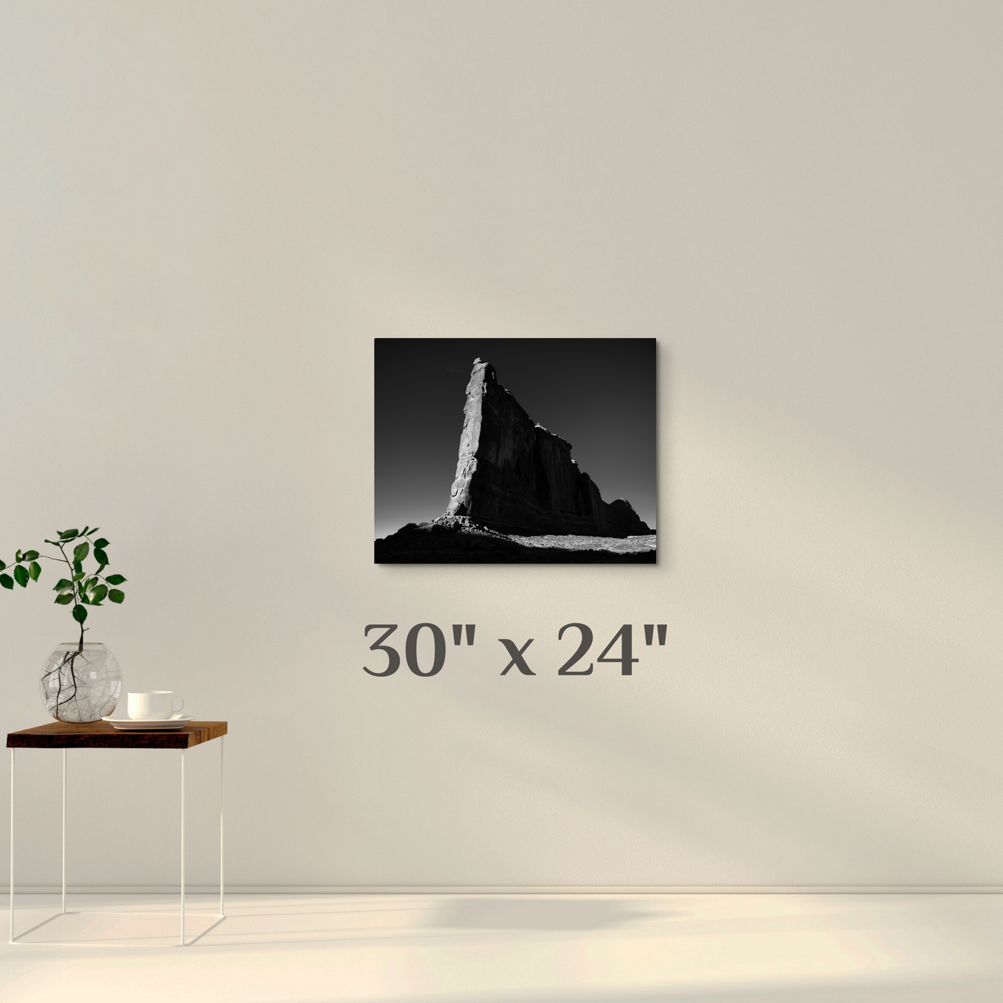 A wall art mockup featuring the black and white photograph titled, "Tower of Babel", shot by landscape photographer J K Lovelace, as a 30 inch wide metal print with inset frame on display