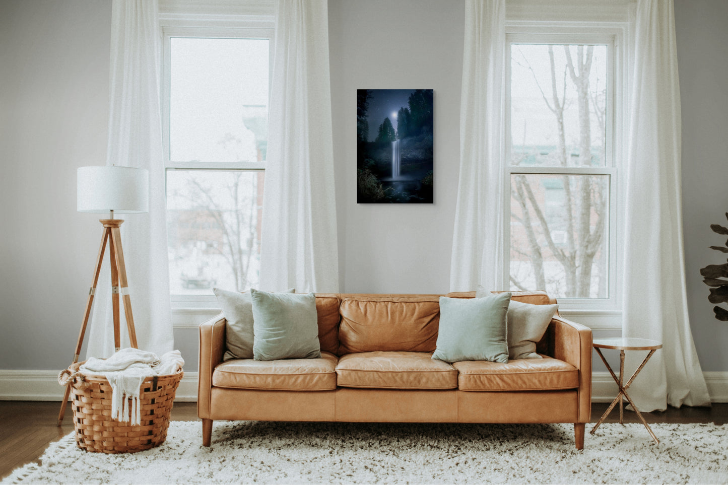 A wall art mockup featuring the photograph titled "Venus in Firs" by landscape photographer Ben Coffman as a 20 inch wide metal print with inset frame on display in a modern apartment.