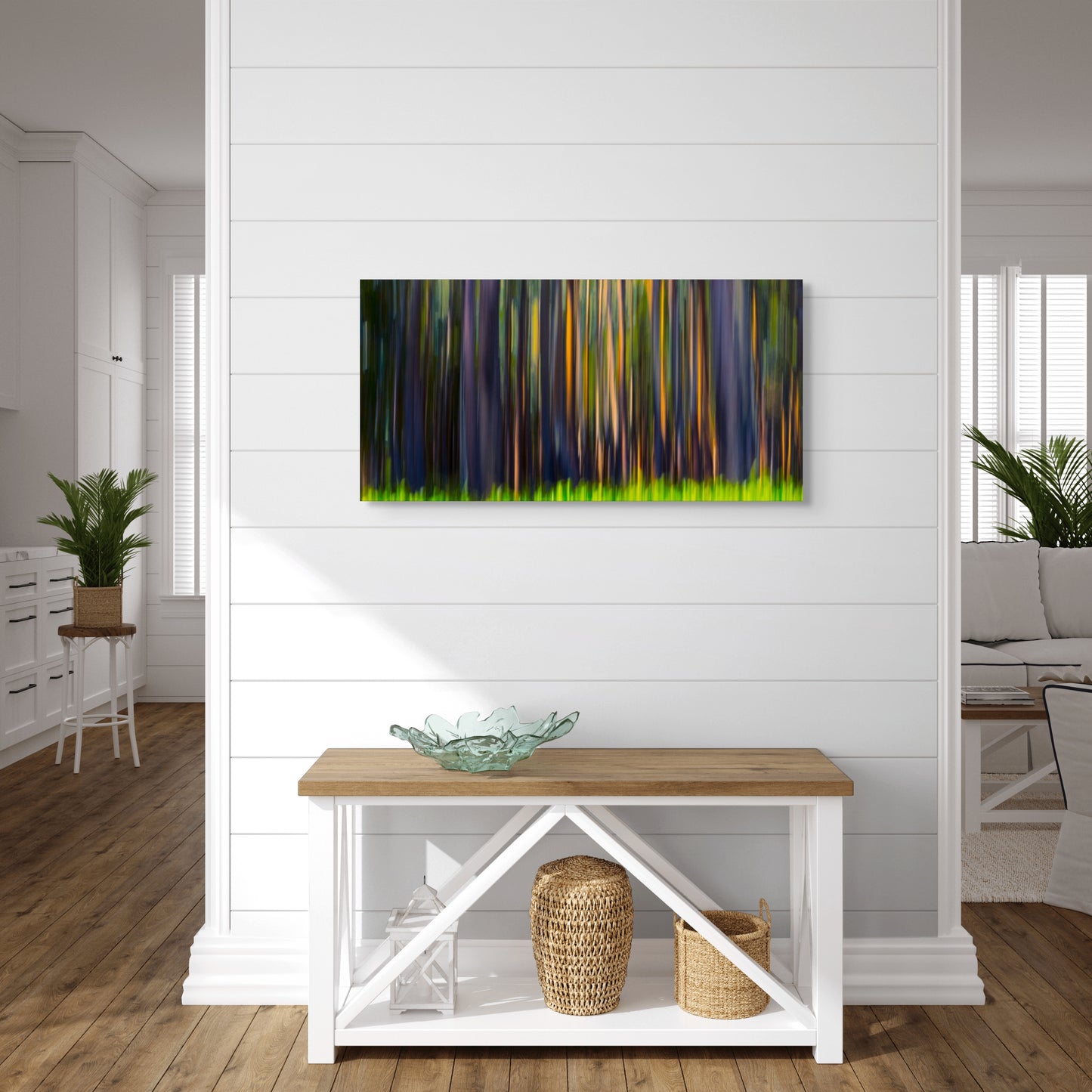A wall art mockup featuring the photograph titled "Rainbow Eucalyptus" by landscape photographer Ben Coffman as a 36 inch wide metal print with inset frame on display in a modern apartment.
