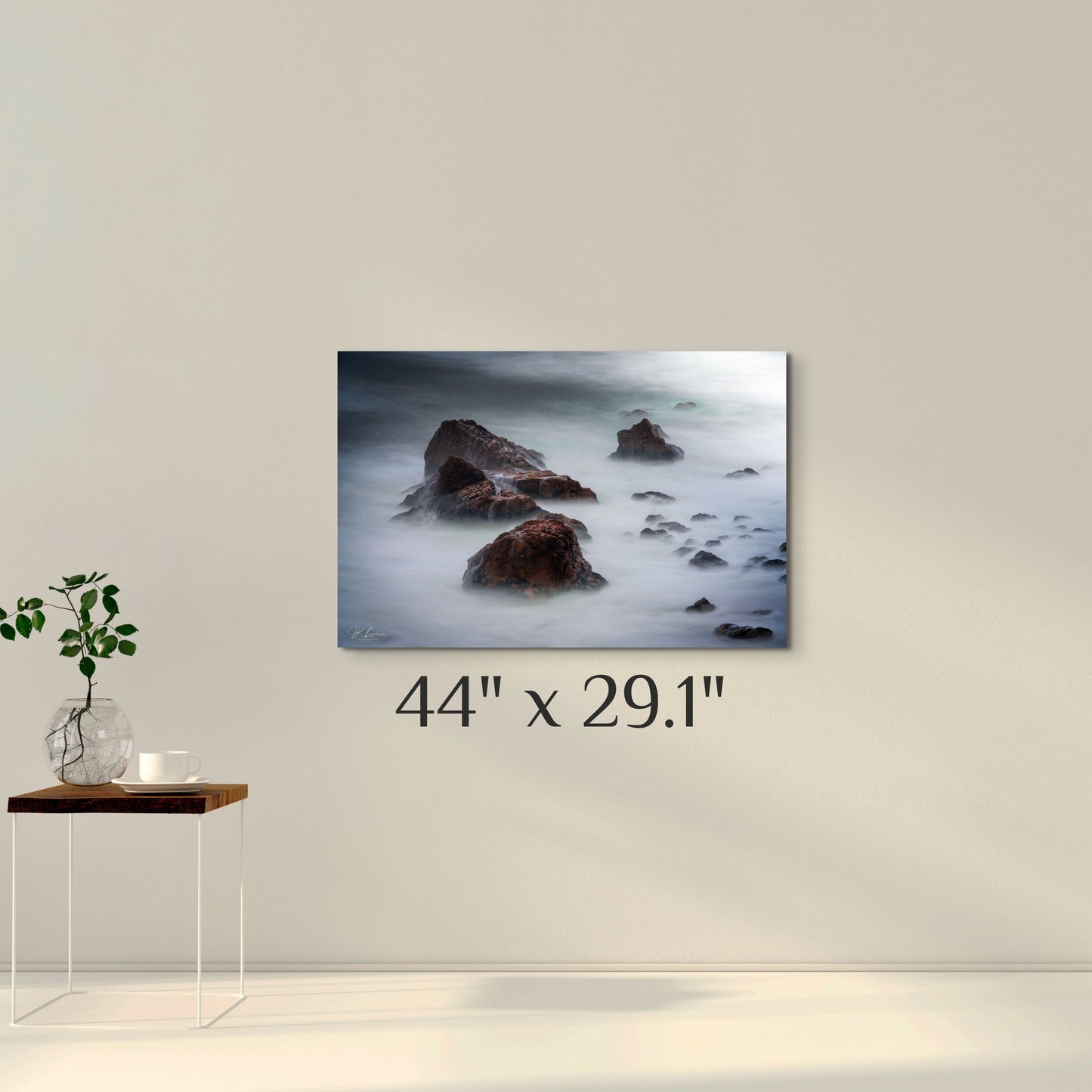 A simple wall art mockup featuring the 44 inch wide metal print titled "Beyond Here Be Dragons" on display on a wall.