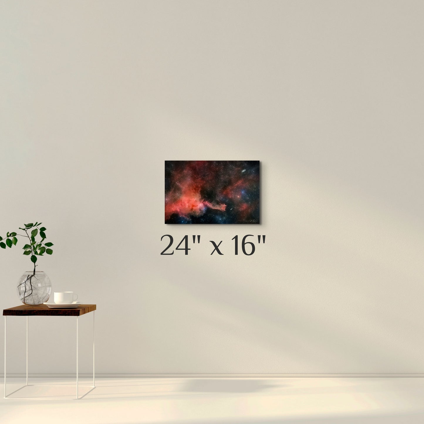 A simple wall art mockup featuring the 24 inch wide metal print titled "Cometary Globule 4 (CG4)" displayed on a wall.