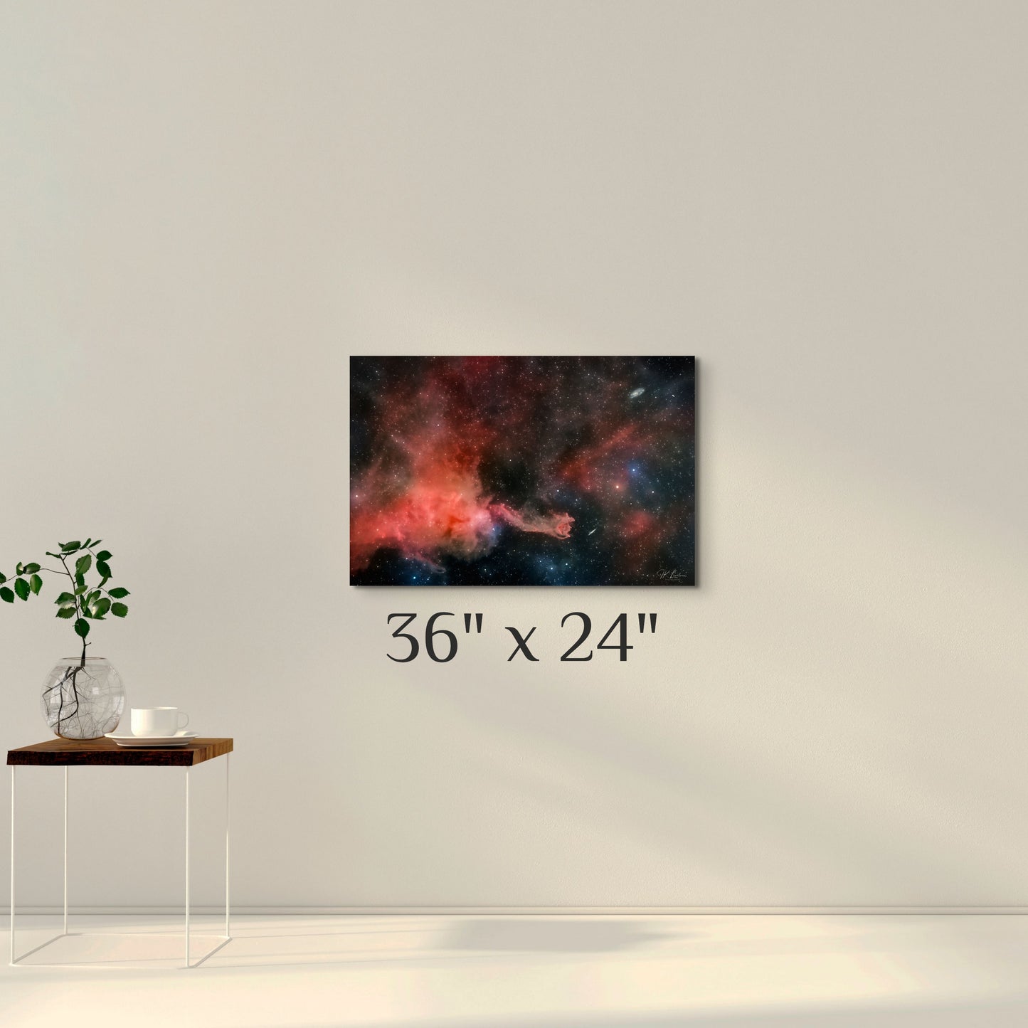 A simple wall art mockup featuring the 36 inch wide metal print titled "Cometary Globule 4 (CG4)" displayed on a wall.