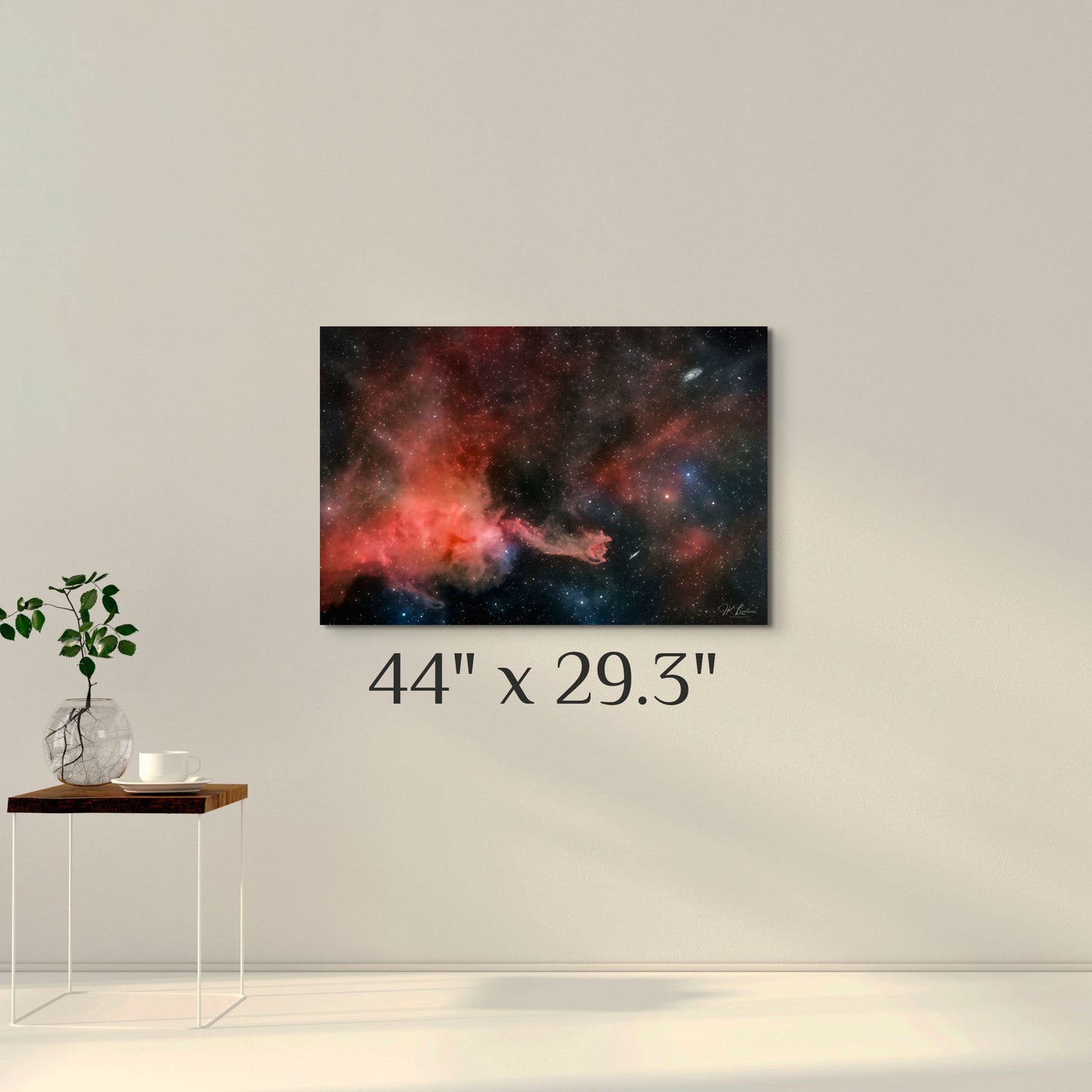 A simple wall art mockup featuring the 44 inch wide metal print titled "Cometary Globule 4 (CG4)" displayed on a wall.
