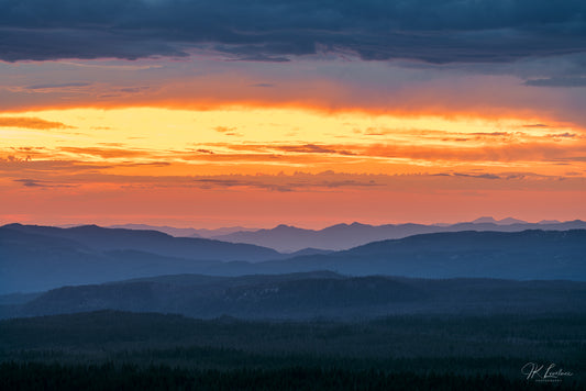 A jpg of the nightscape panoramic photograph titled "Melting Into Saffron" shot by landscape photographer J K Lovelace featuring Crater Lake National Park at sunset