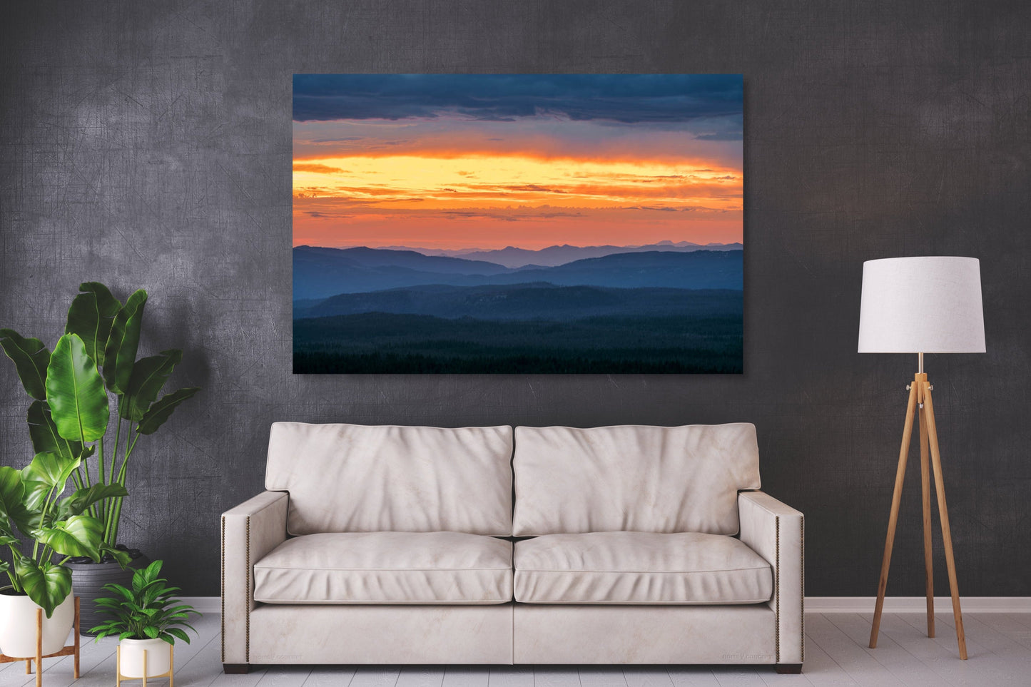 A wall art mockup of the metal print titled "Melting Into Saffron" in inset frame displayed above a cream colored fabric loveseat against a dark gray wall.