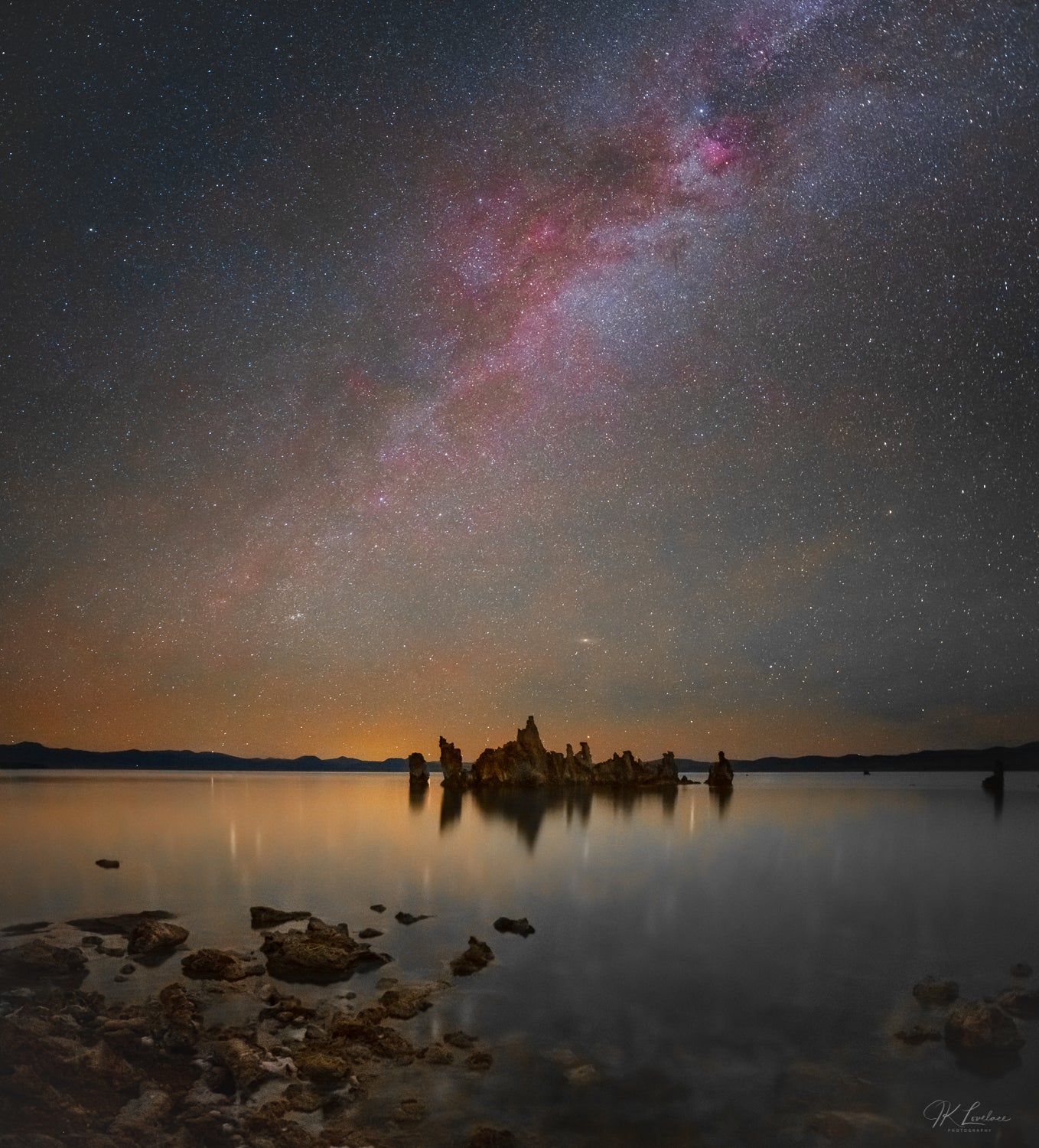 A jpg of the nightscape photograph titled "Mono Midnight" shot by landscape photographer J K Lovelace featuring the red Hydrogen II regions of the Milky Way shining over Mono Lake