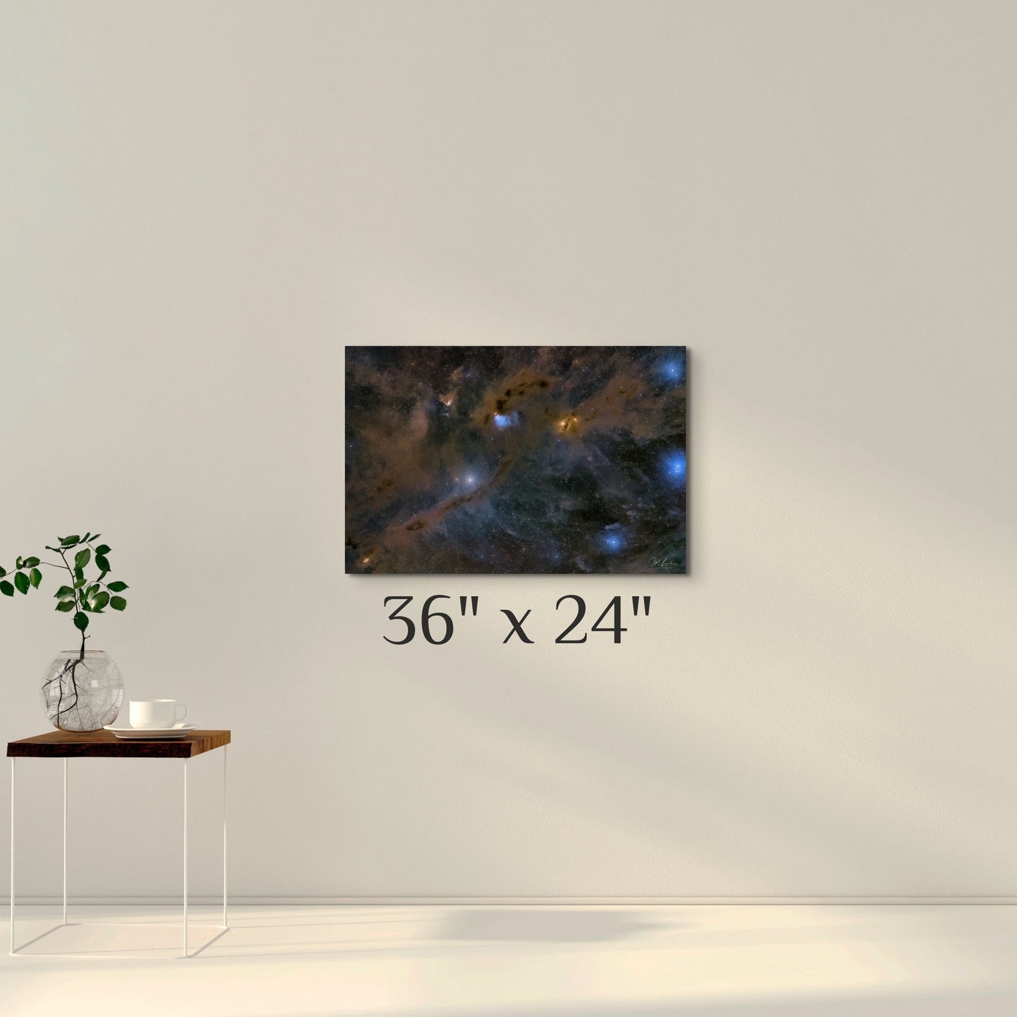 A simple wall art mockup featuring the 36 inch wide metal print titled "Nebulas LBN 782 and Barnard 7" displayed on a wall.