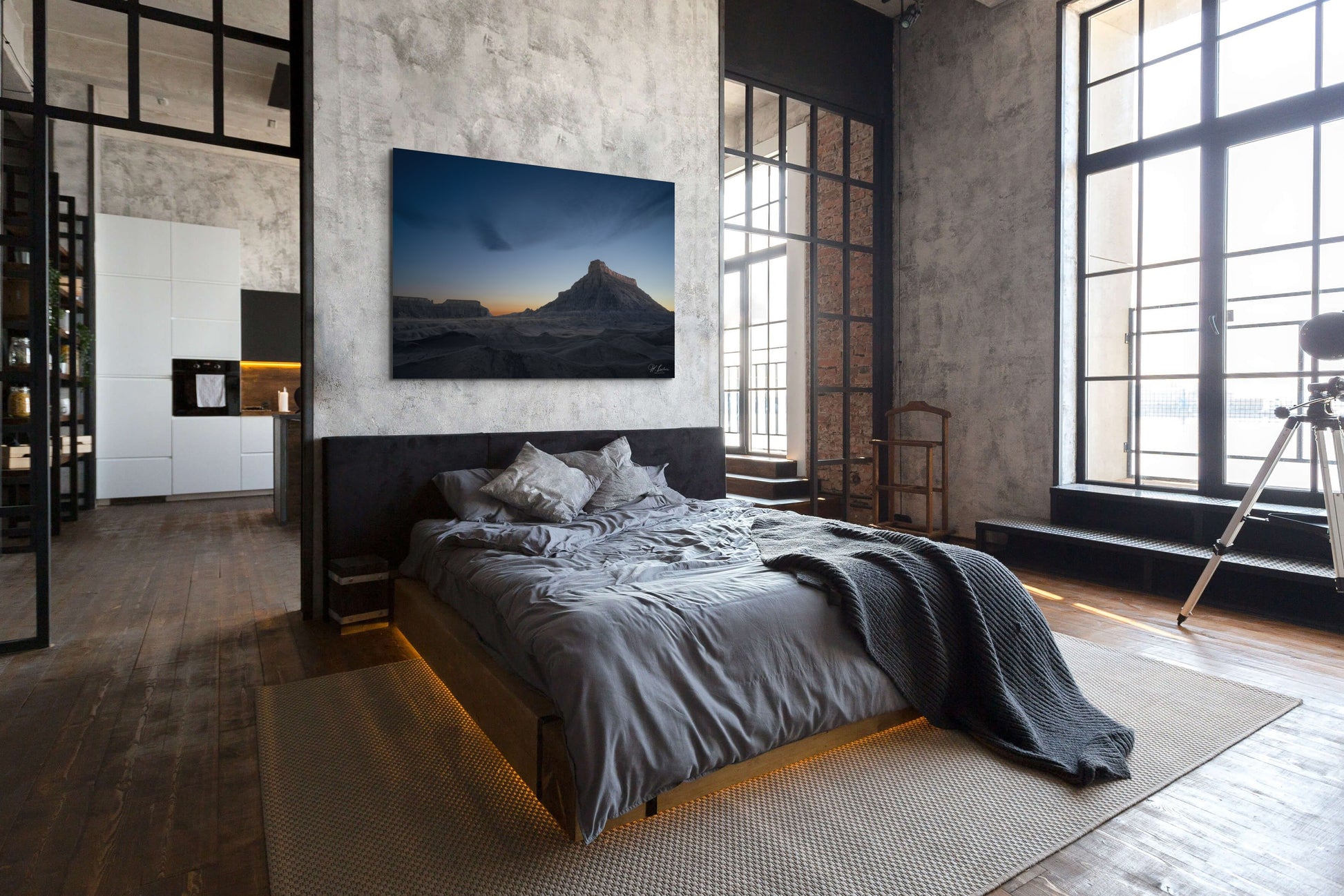 A wall art mockup featuring the 60 inch wide metal print titled "Night Shift" in inset frame on display in a upscale industrial loft