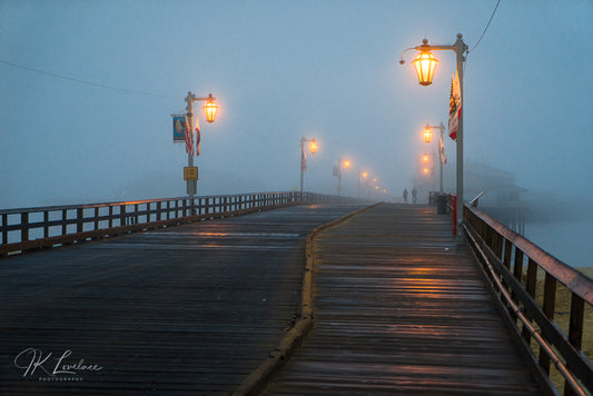 A jpg of the seascape photograph titled "Pier Into the Mist" shot by landscape photographer J K Lovelace featuring a foggy Stearns Wharf in Santa Barbara, California