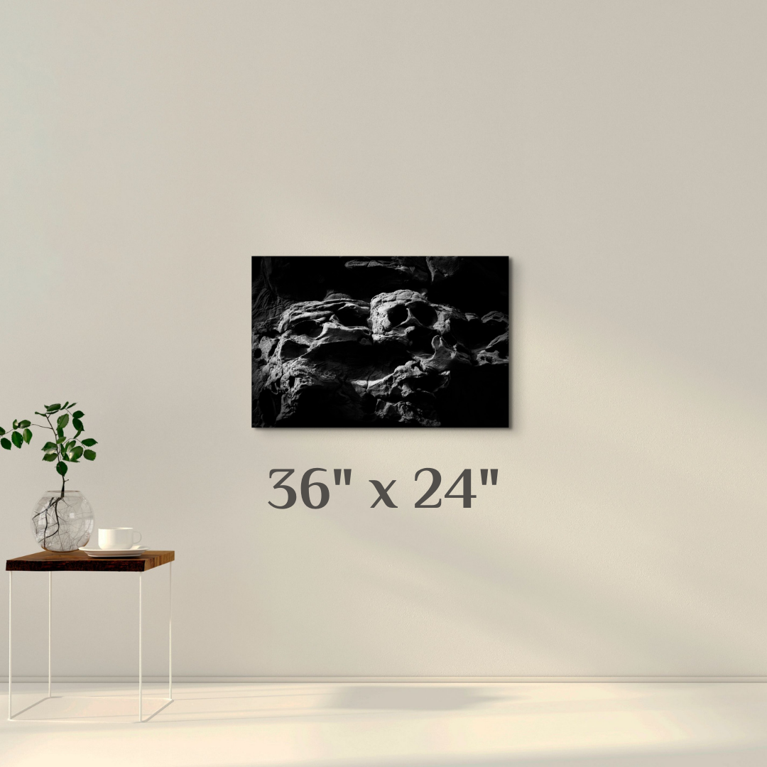 A simple wall art mockup featuring the 36 inch wide metal print titled "The Skull of Ozymandias" displayed on a wall.