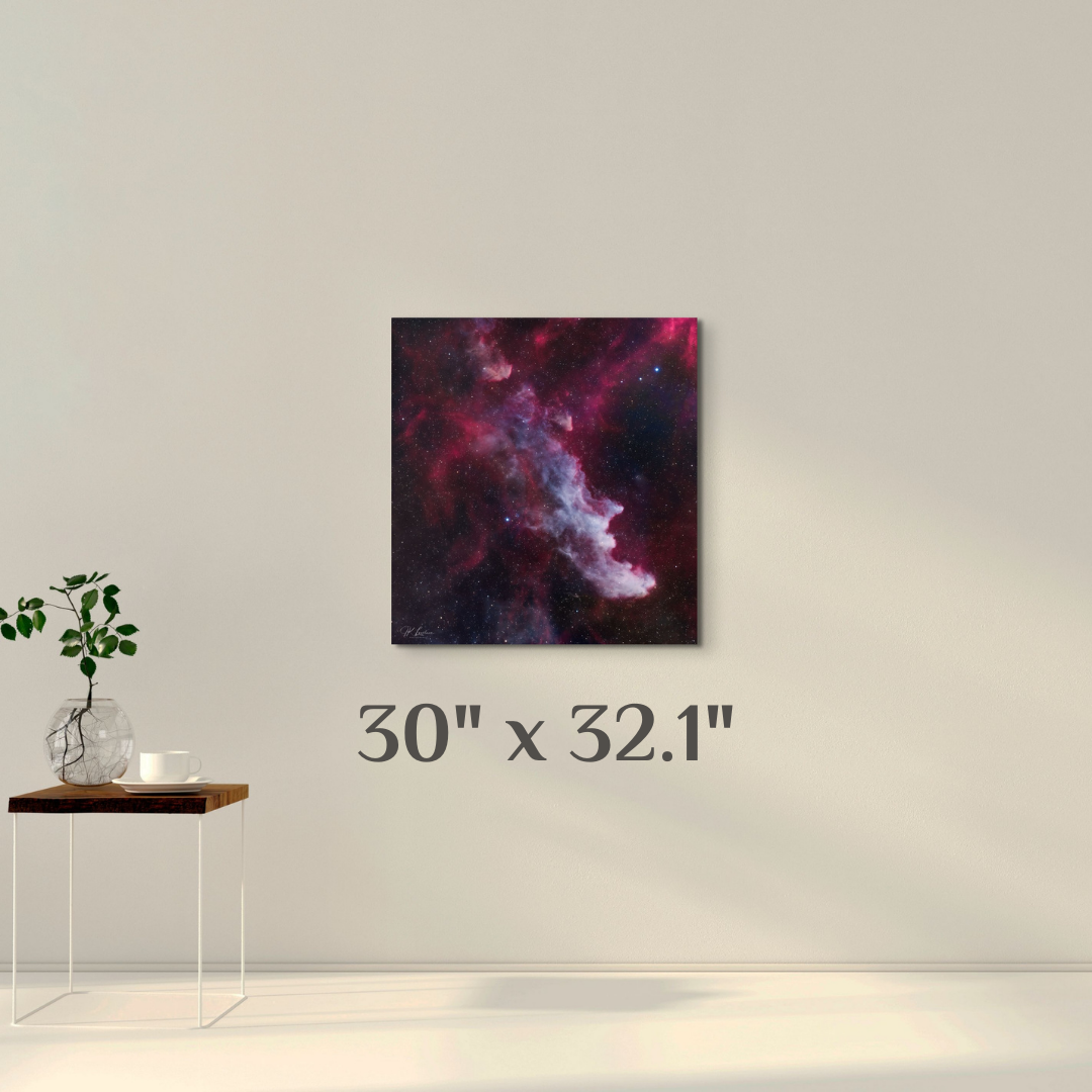 A simple wall art mockup featuring the 30 inch wide metal print titled "The Wicked Witch of Orion" on display on a wall.