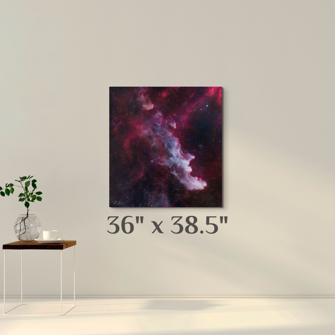 A simple wall art mockup featuring the 36 inch wide metal print titled "The Wicked Witch of Orion" on display on a wall.
