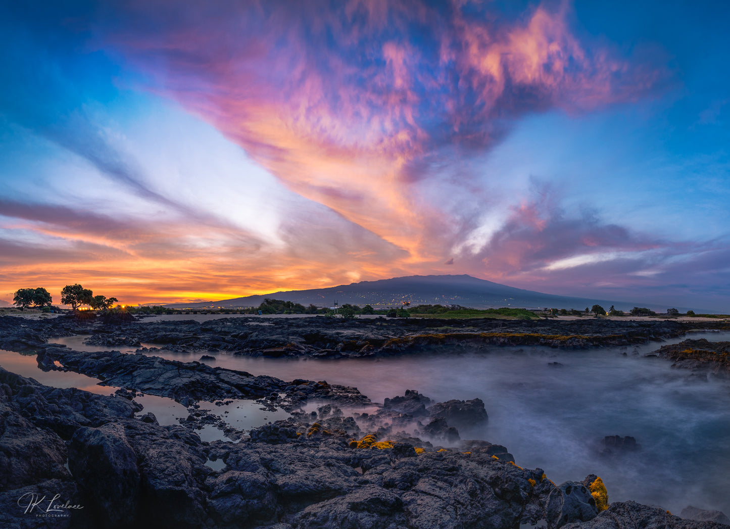 A jpg of the daylight landscape photograph titled "Wawaloli" shot by landscape photographer J K Lovelace featuring a rainbow sunrise at Wawaloli Beach Park and tidal pools
