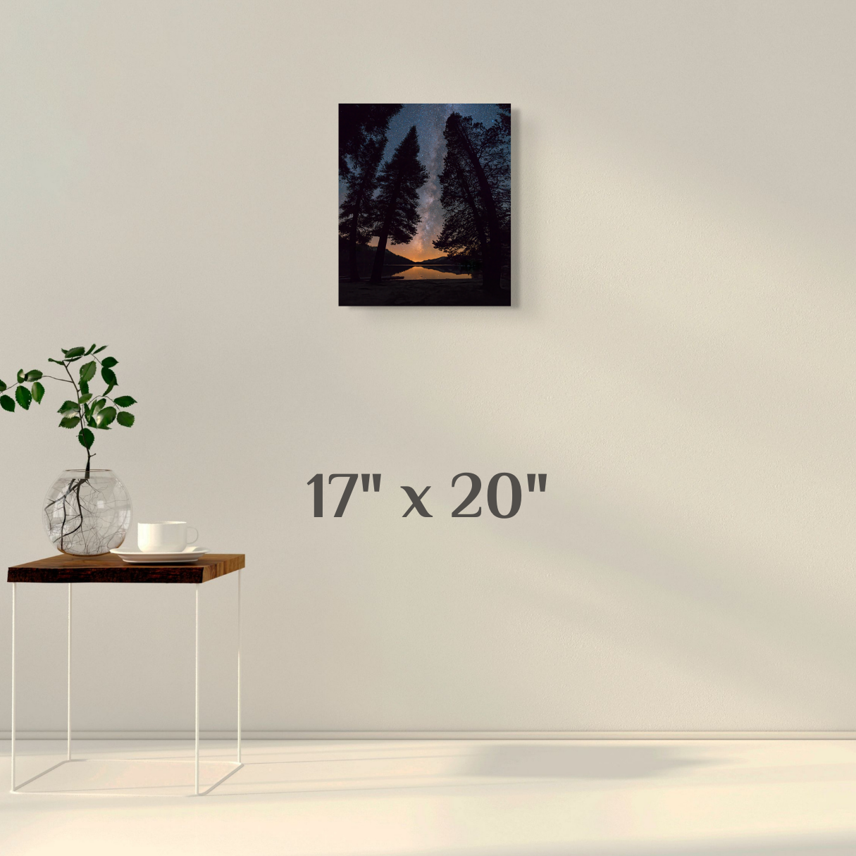 A wall art mockup featuring the night photograph titled, "All is Calm" shot by landscape photographer J K Lovelace, on display as a 17 inch wide metal print with inset frame.