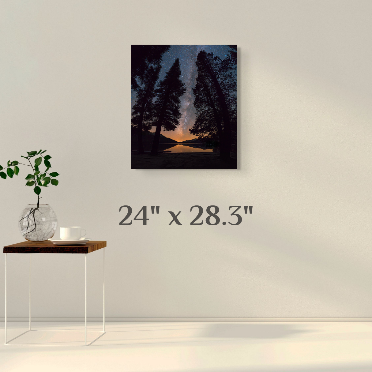 A wall art mockup featuring the night photograph titled, "All is Calm" by landscape photographer J K Lovelace, on display as a 24 inch wide metal print with inset frame.