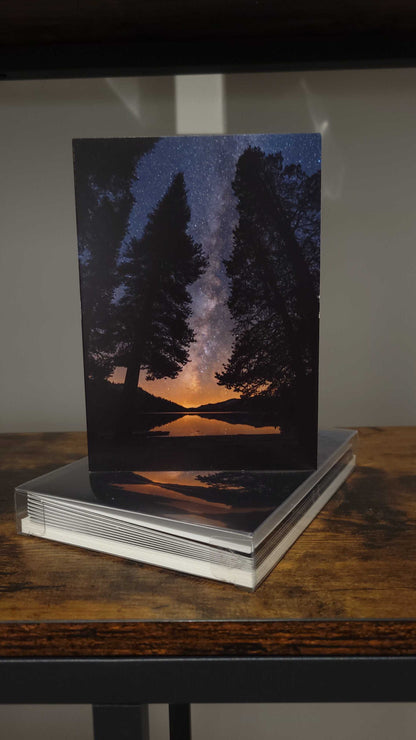 A photograph of a holiday greeting card set featuring the photograph "All is Calm" on the front cover