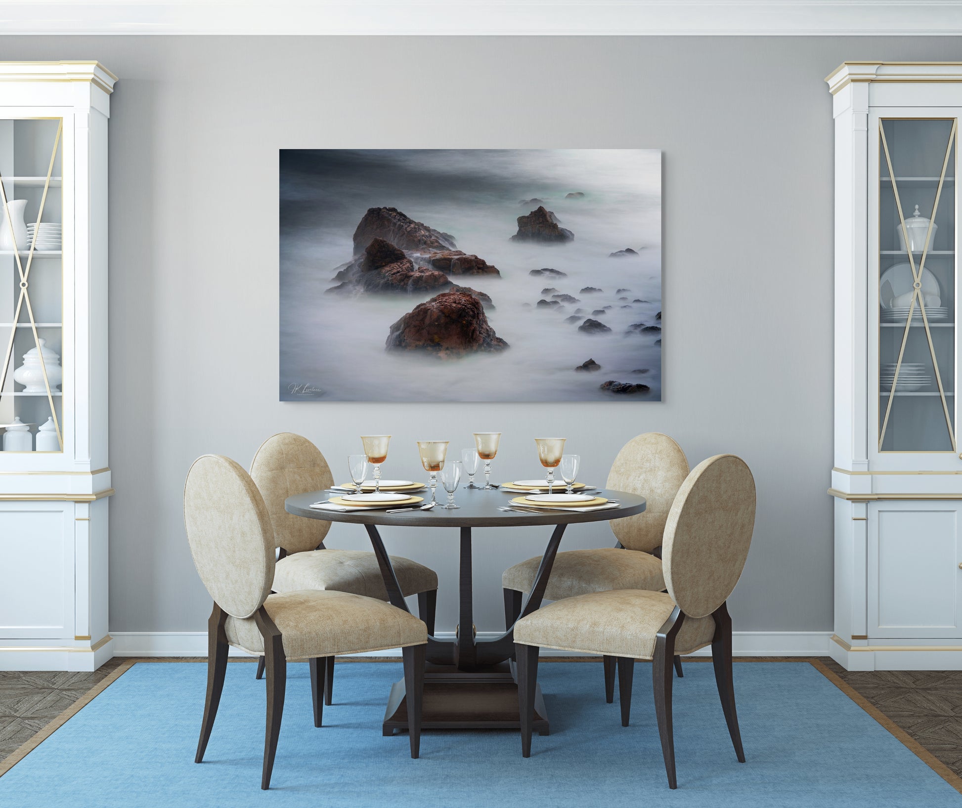 A wall art mockup featuring the photograph titled "Beyond Here Be Dragons" by landscape photographer J K Lovelace as a 60 inch wide metal print with inset frame on display in a traditional dining room.
