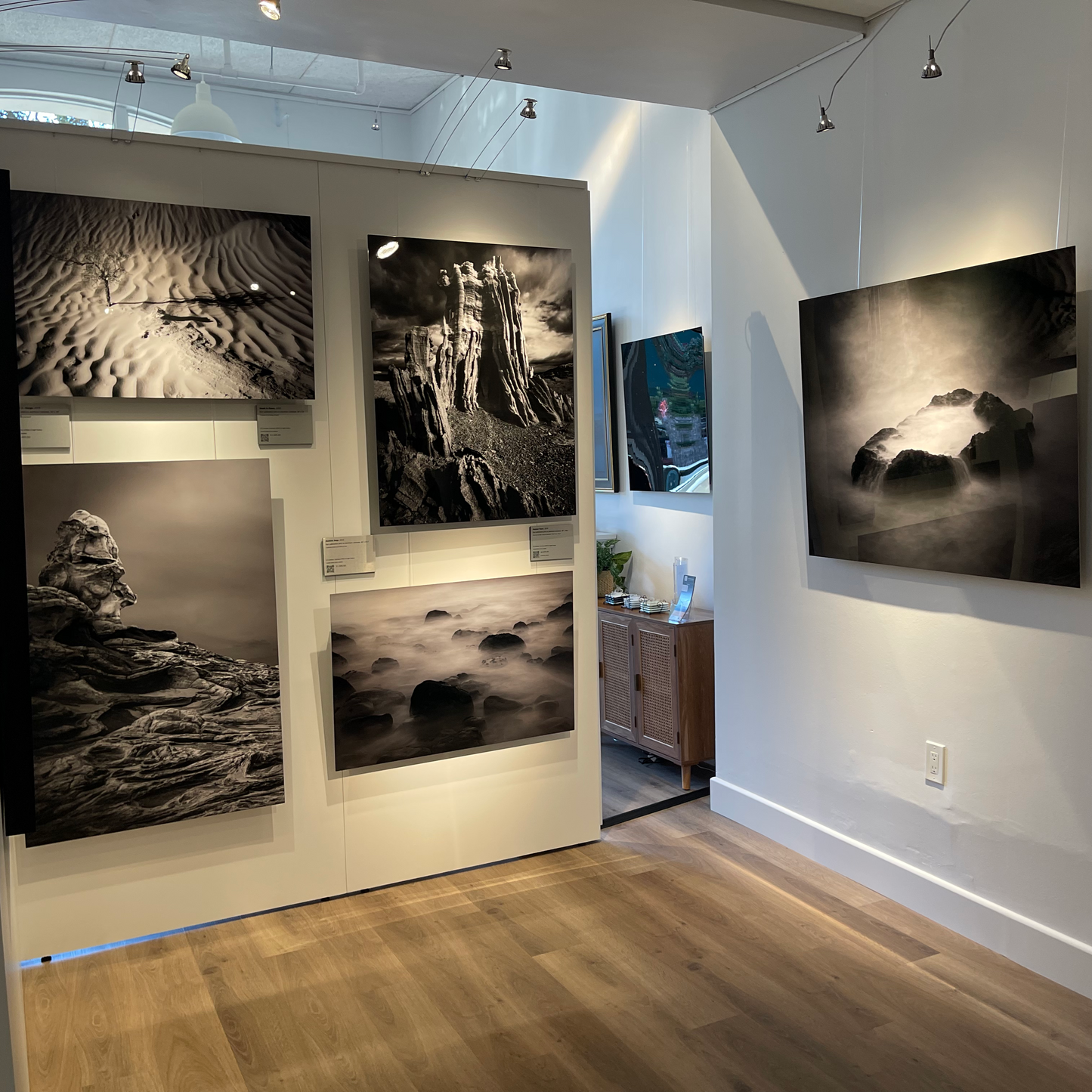 A photograph of the black and white cove within the gallery where black and white metal prints are displayed.