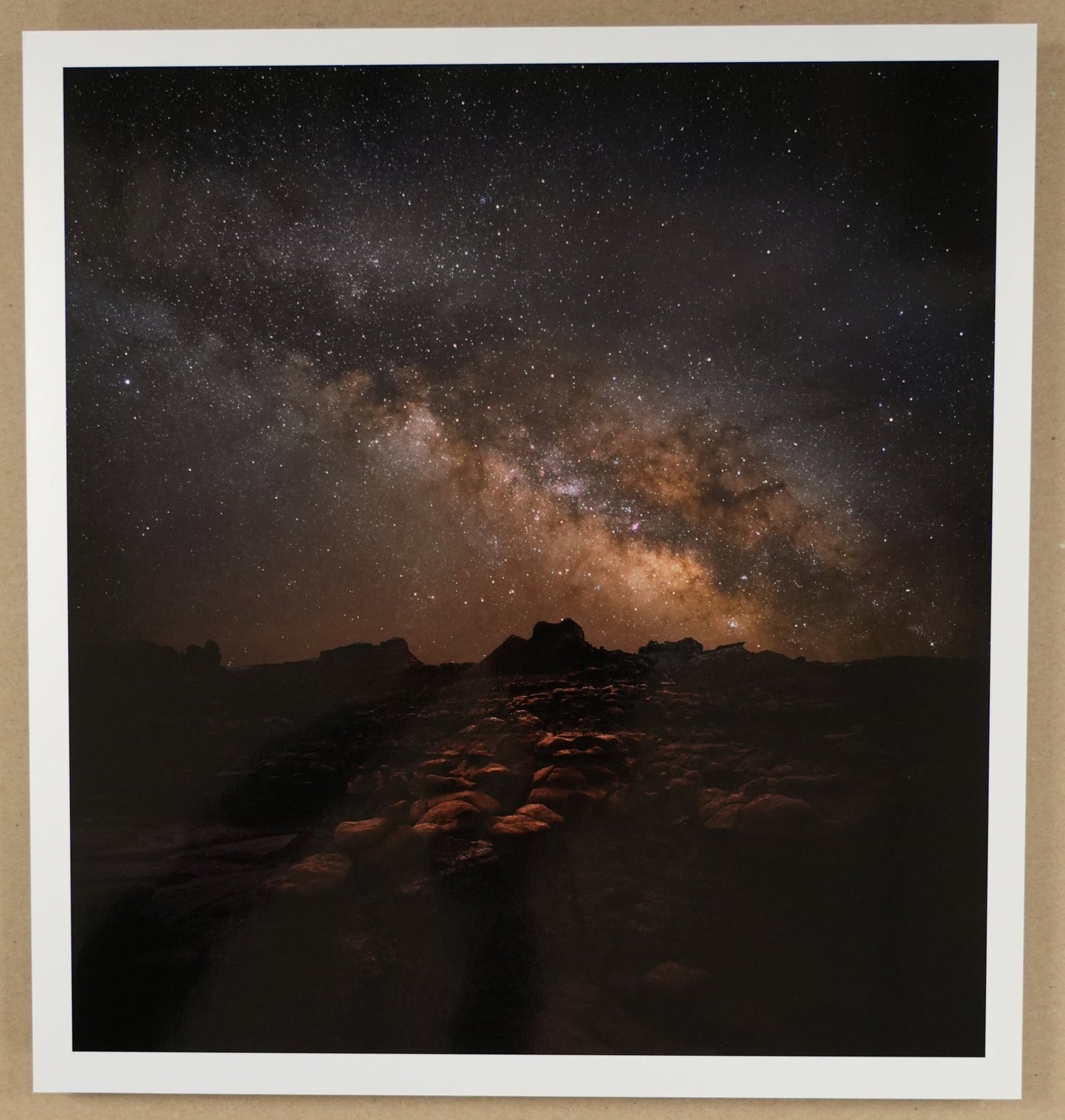 Framed photograph of a night sky with stars and Milky Way galaxy.