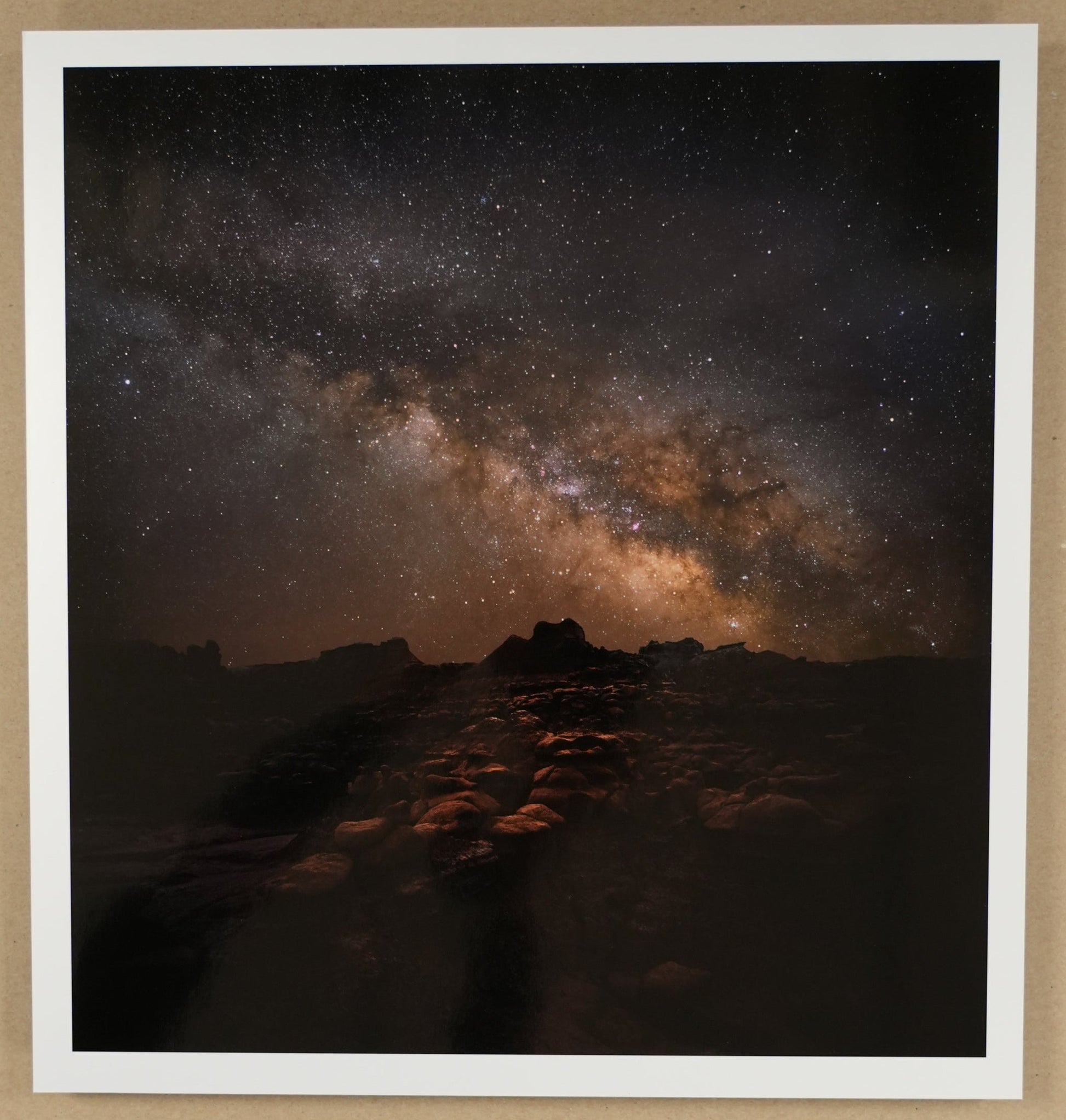 Framed photograph of a night sky with stars and Milky Way galaxy.