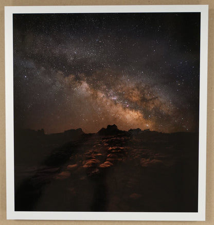 Framed photograph of a night sky with stars and Milky Way galaxy.