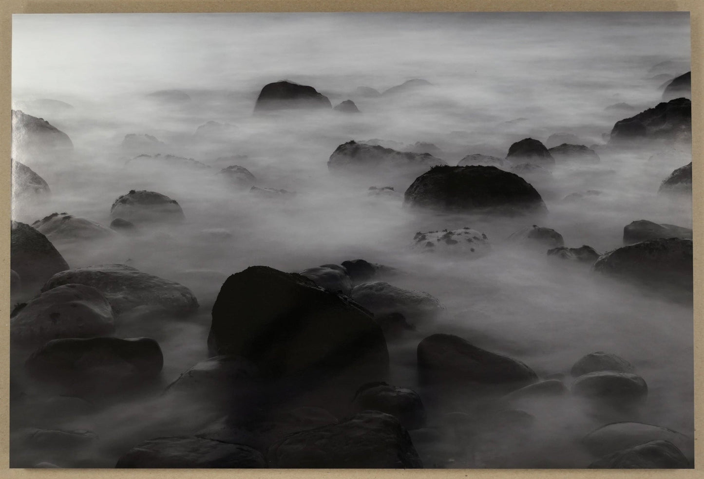 Framed black and white photograph of a rocky landscape