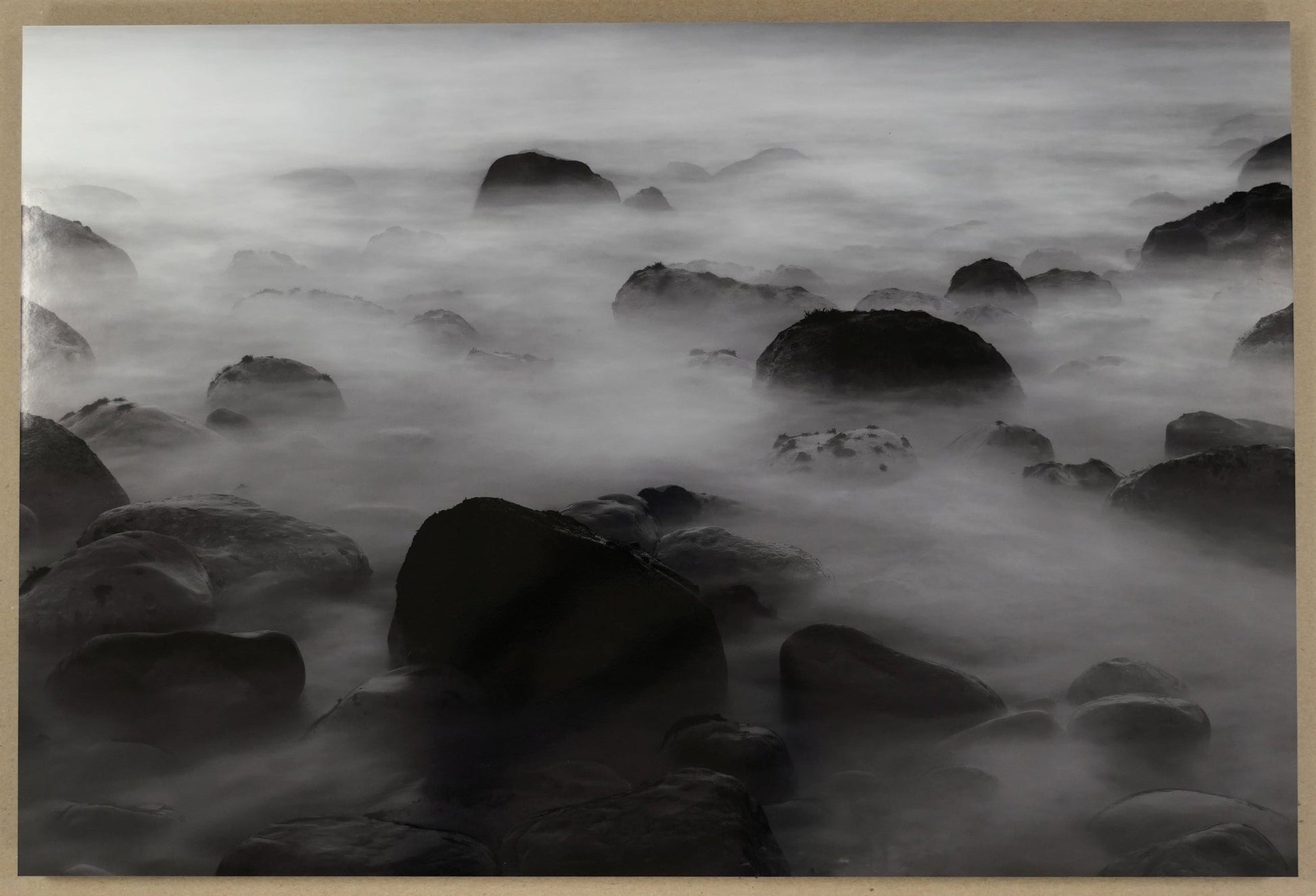 Framed black and white photograph of a rocky landscape