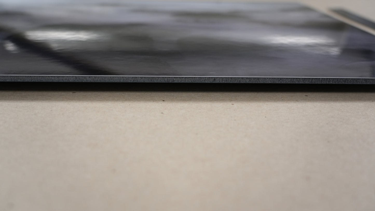Close-up of a black surface with a blurred background