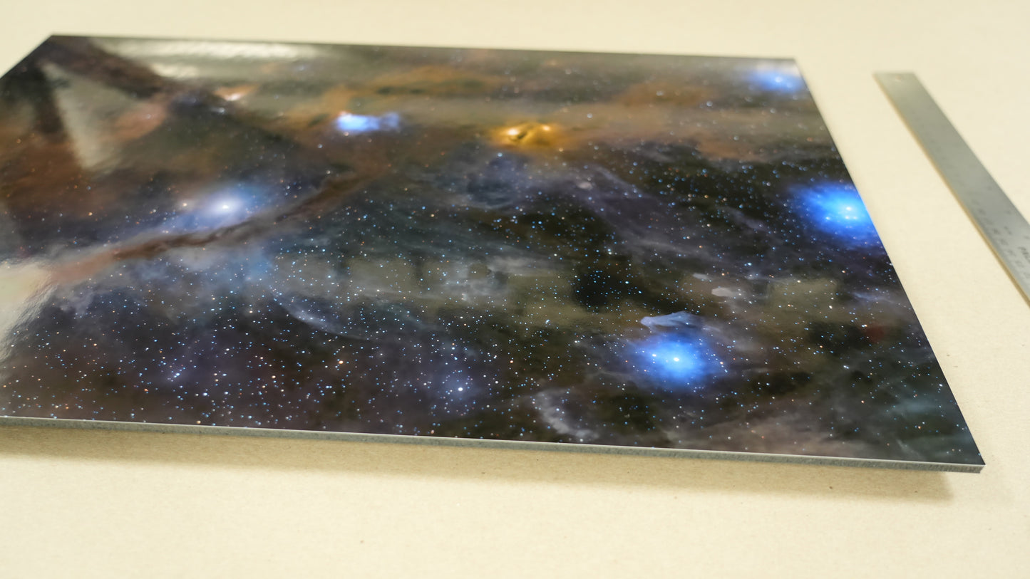 Space-themed decorative panel with nebula design on a white surface