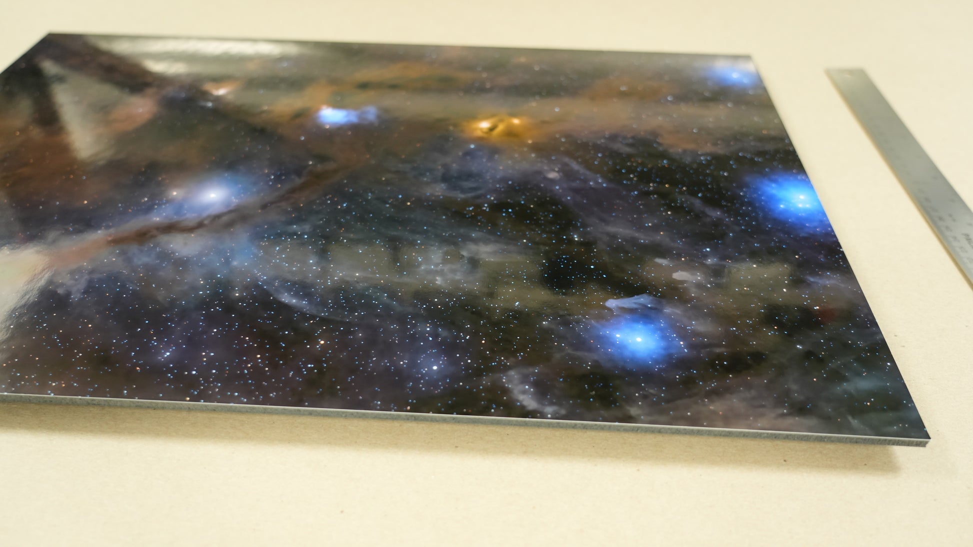Space-themed decorative panel with nebula design on a white surface