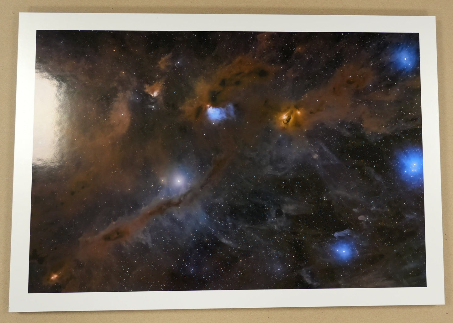 Space nebula print on a beige background with a ruler for scale.